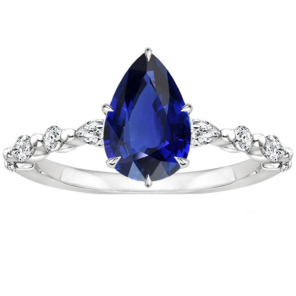 Best Ladies Pear Diamond Anniversary Ring With Blue Sapphire Center Gold