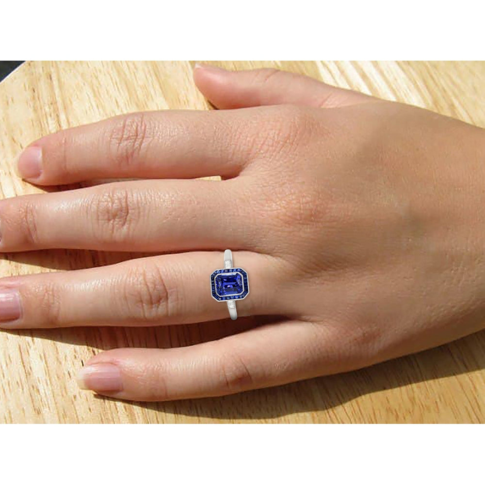 Women Halo Gemstone Blue Sapphires Ring on hand Baguette Diamonds
