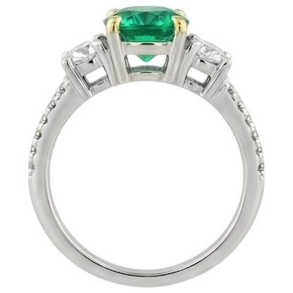 natural round emerald 2ct ring on white background
