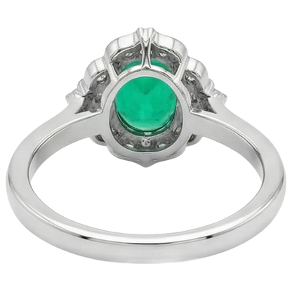 natural round emerald 2ct ring on white background