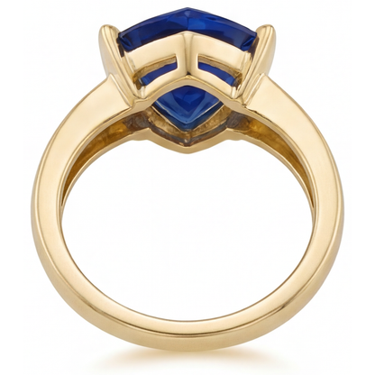 Blue Sapphire Trillion Cut Gemstone Ring in 14 Karat Yellow Gold – angle view