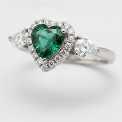 Heart Cut Emerald and Diamond Three Stone Halo Ring Natural Platinum