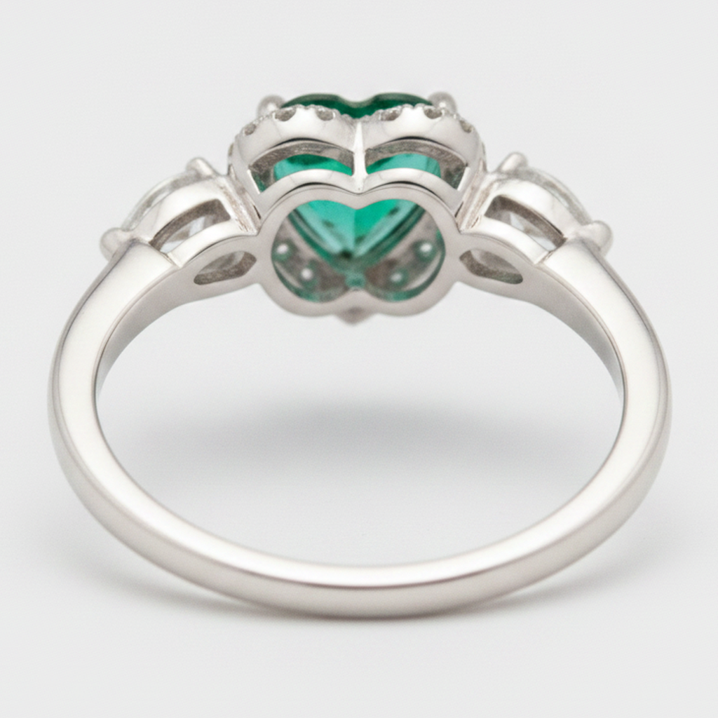 Heart Cut Emerald and Diamond Three Stone Halo Ring Natural Platinum