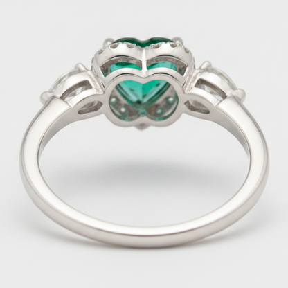 Heart Cut Emerald and Diamond Three Stone Halo Ring Natural Platinum
