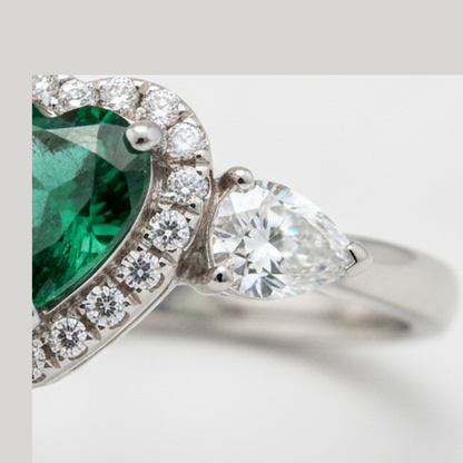 Heart Cut Emerald and Diamond Three Stone Halo Ring Natural Platinum
