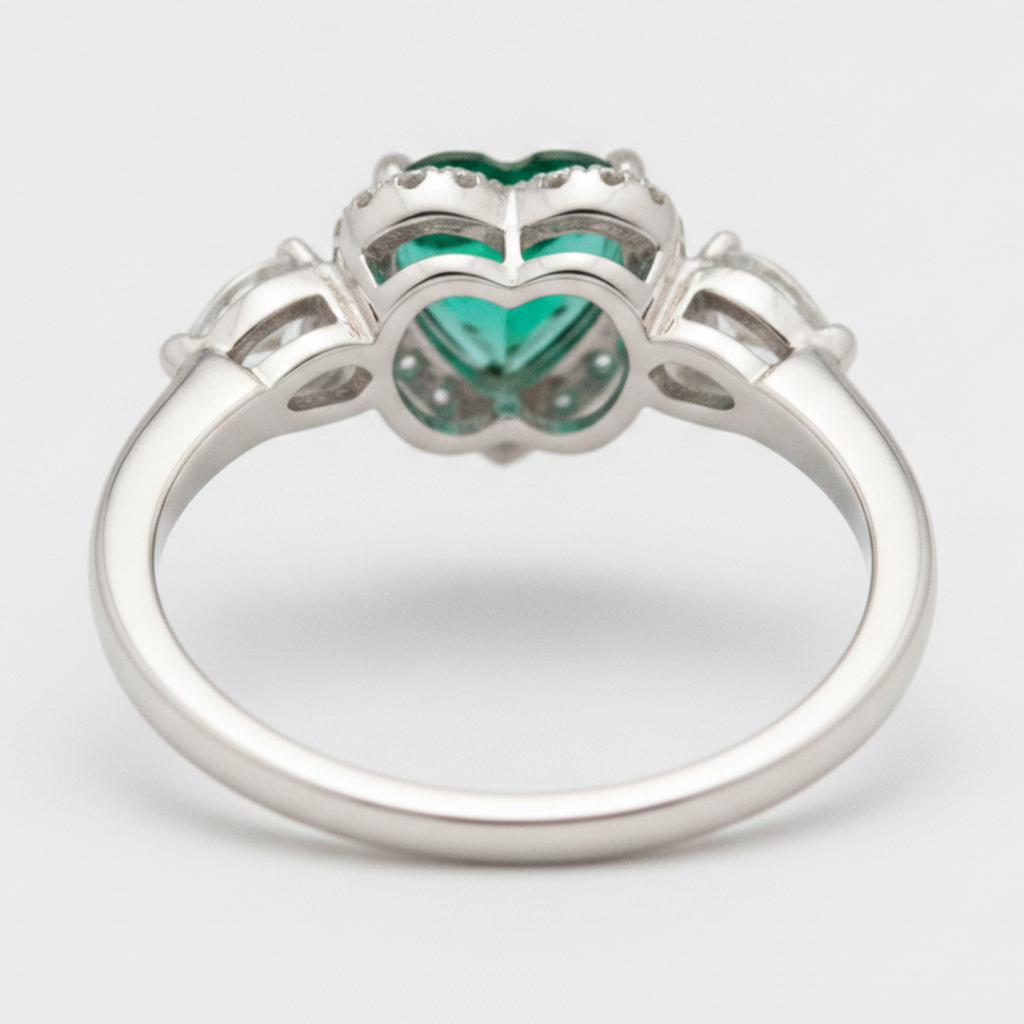 Heart Cut Emerald and Diamond Three Stone Halo Ring Natural Platinum