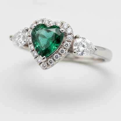 Heart Cut Emerald and Diamond Three Stone Halo Ring Natural Platinum