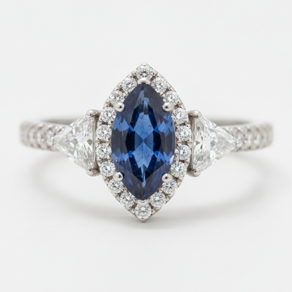 Marquise Blue Sapphire and Diamond Three Stone Halo Ring Natural Platinum