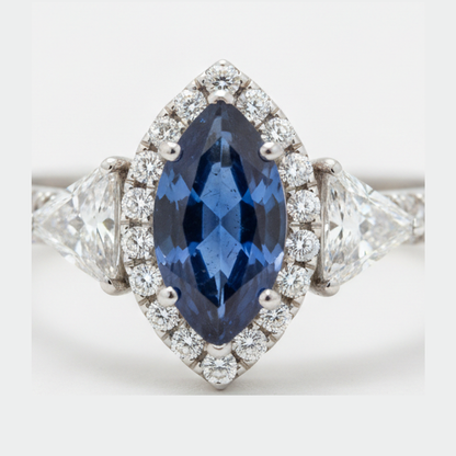 Marquise Blue Sapphire and Diamond Three Stone Halo Ring Natural Platinum