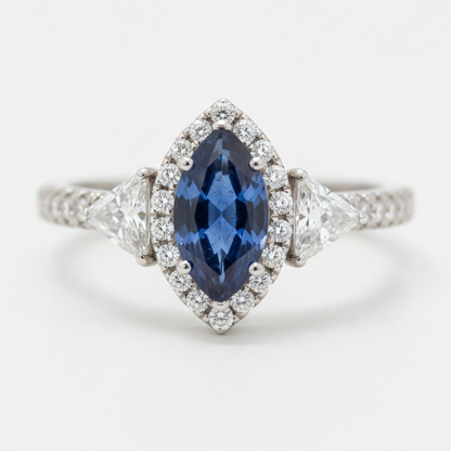 Marquise Blue Sapphire and Diamond Three Stone Halo Ring Natural Platinum