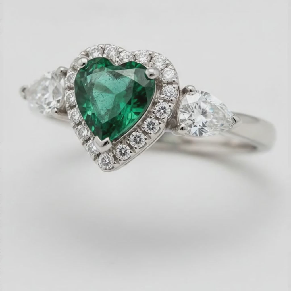 Heart Cut Emerald and Diamond Three Stone Halo Ring Natural Platinum