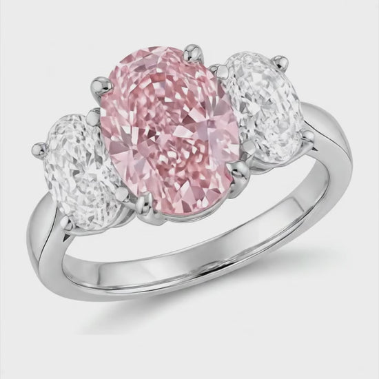 2.5 Carat Oval Pink Lab Grown Diamond and White Diamond Three Stone Ring 14K White Gold