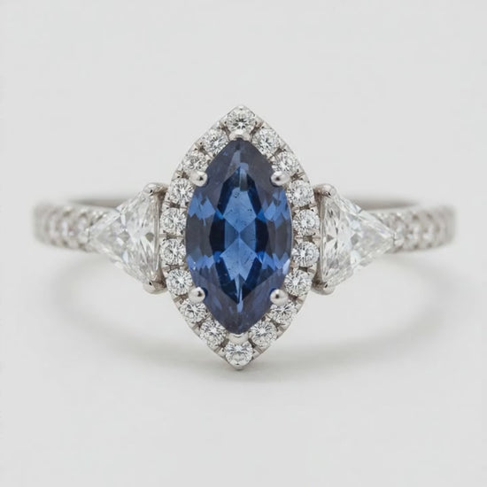 Marquise Blue Sapphire and Diamond Three Stone Halo Ring Natural Platinum