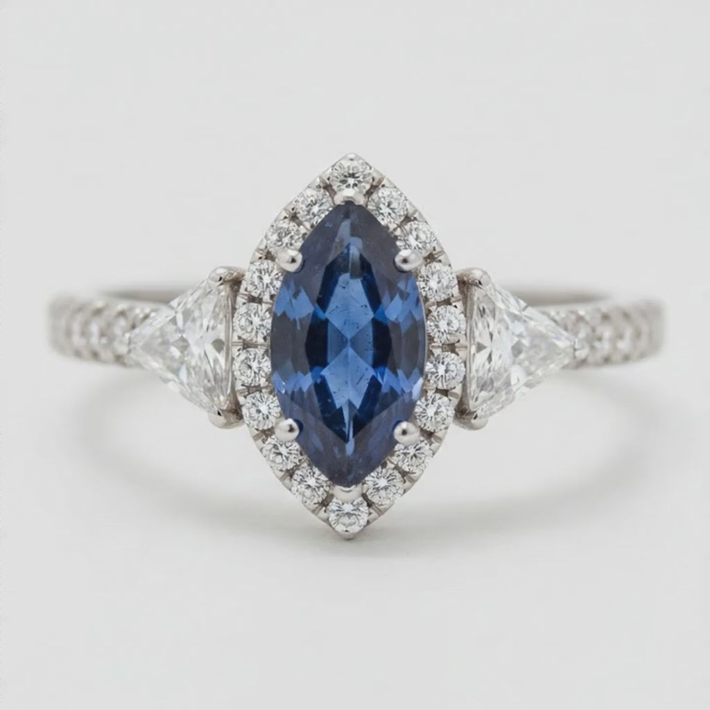 Marquise Blue Sapphire and Diamond Three Stone Halo Ring Natural Platinum