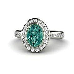 Fancy Lady’s Green Oval Sapphire And Diamond Ring White Gold