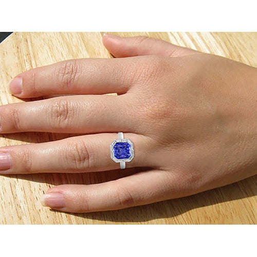 Ladies on hand Baguette Diamond Halo Radiant Blue Sapphire Ring